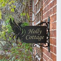 Side View of the Liver Bird Wall Bracketed House Name Sign