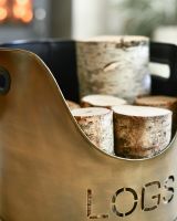 Close Up Of "LOGS" Log & Kindling Holder In Antique Brushed Gold Close Up Of "LOGS" Log & Kindling Holder In Antique Brushed Gold