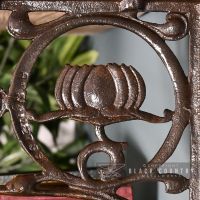 Close-up of the "Lotus Flower" Design on the Iron Shelf Bracket