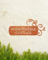 "Lovestone" Corten Steel House Name Sign in Situ on a Painted House Wall