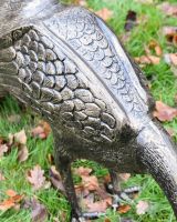 Close-up of the Antique Bronze Finish on the Majestic Peacock Sculpture