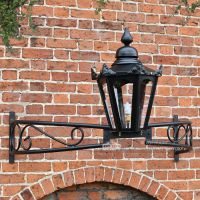 Manor house lighting above doorway