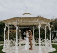 Customer photograph of the "Lady Leticia" Bandstand Gazebo in Use - Manor By the Lake Customer photograph of the "Lady Leticia" Bandstand Gazebo in Use - Manor By the Lake