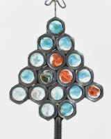 Close up of Scrap Materials Christmas Tree Sculpture nuts and marbles