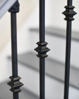 Close-up of the Traditional Knuckle Design on the Stair Spindles Close-up of the Traditional Knuckle Design on the Stair Spindles