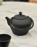 Matte Black Cast Iron Teapot with handles down Matte Black Cast Iron Teapot with handles down