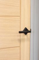 Matte Black Textured Unsprung Lever Door Handle on Diamond Rose on Door Matte Black Textured Unsprung Lever Door Handle on Diamond Rose on Door