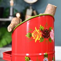 Close up of red "Rosalie" coal hod