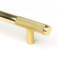 The Medium Half Knurled Cabinet Pull Handle in Polished Brass Showing a Close up of the Edge of the Handle