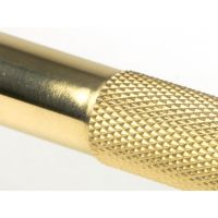 The Medium Half Knurled Cabinet Pull Handle in Polished Brass Showing a Close up of the Diamond Knurled Pattern Grip