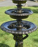 Close up of ornate detail on mermaid water fountain Close up of ornate detail on mermaid water fountain