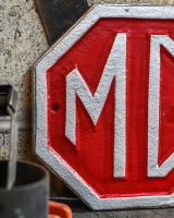 Close up of MG Vintage Style Cast Iron Sign finish