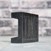 Close up of base on simplistic rectangular drain or air cover