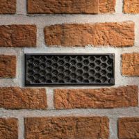 Black "Honeycomb" Cast Iron Air Brick in the Home installed ai illustration