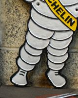 Close up of leg detail on michelin man wall sign