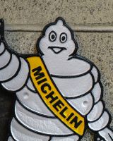 Close up of "Michelin Man" Cast Iron Automobilia Reproduction Sign finish Close up of "Michelin Man" Cast Iron Automobilia Reproduction Sign finish