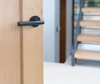 Midnight Black Textured Lever Door Handle on Rose on Door