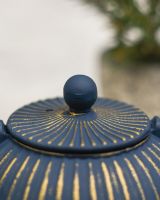 Close-Up of Teapot Lid in Blue and Gold Finish