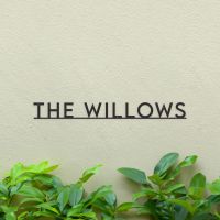 Minimalist House Name sign Black on green wall Minimalist House Name sign Black on green wall