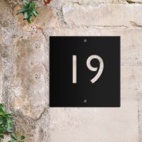 Modern Black Square House Number Sign on brick wall