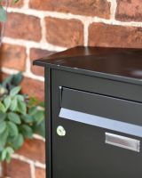 Close-Up of Front Opening Letter Plate on Modern Black Steel Front Opening Wall Mounted Post Box with Lock