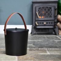 Black Modern Ash Bucket in Situ Next to the Fire Place Black Modern Ash Bucket in Situ Next to the Fire Place