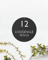 Modern Circular Steel House Sign Finished in Black