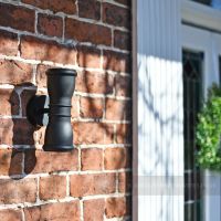 Modern cone wall light with circular backplate