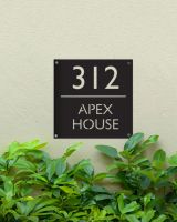 Steel Square House Number Sign in Situ on a Green Painted House Wall  Steel Square House Number Sign in Situ on a Green Painted House Wall