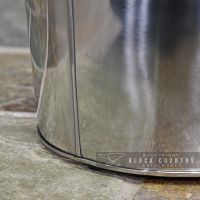 Close of the Base of the Modern Stainless Steel Ash Bucket Close of the Base of the Modern Stainless Steel Ash Bucket