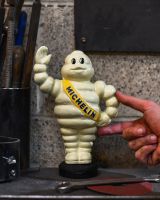 scale image of michelin man moneybox