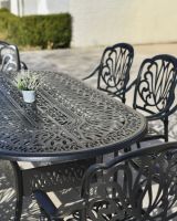 Closr Up Of The Ornate Design On The Moreville Furniture Set