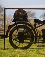 ‘Frontline’ Rustic Wall Art of a Vintage Motorbike close up of rear wheel and helmet