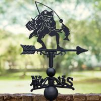 Black Mr Frog Weathervane with trees in background