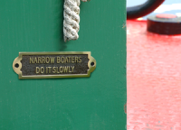 "Narrow Boaters Do It Slowly" Polished Brass Sign