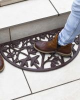Scale Shot of Natural Cast Iron Ornate "Nature in Flight" Arched Doormat