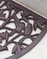Close-Up of Sitting Birds on Cast Iron Arched Doormat