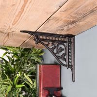 Black Shelf Bracket in Situ Holding a Wooden Shelf