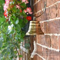 Sid View of the 5" Antique Brass Bell with Rope Lanyard