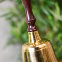 Detailed image of rosewood handle and solid brass bell