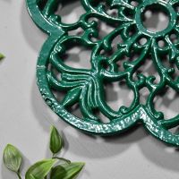 Cast Iron Flower Petal Trivet in Green Close-Up Cast Iron Flower Petal Trivet in Green Close-Up
