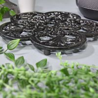 Black Cast Iron Flower Trivet Side Angle Black Cast Iron Flower Trivet Side Angle