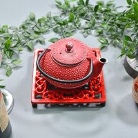 Red Cast Iron Square Trivet in Use with Teapot Red Cast Iron Square Trivet in Use with Teapot