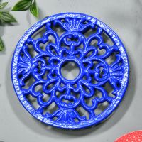 Blue Round Cast Iron Trivet on Grey Surface