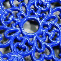 Blue Round Cast Iron Trivet Close-Up