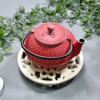 Cream Round Cast Iron Trivet in Use with Teapot