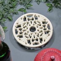 Cream Round Cast Iron Trivet in Situ