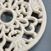 Cream Round Cast Iron Trivet Close-Up