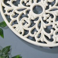 Cream Cast Iron Oval Trivet Close-Up Cream Cast Iron Oval Trivet Close-Up