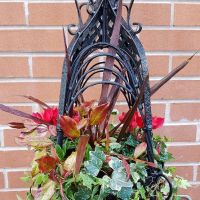Black hanging basket with flowers